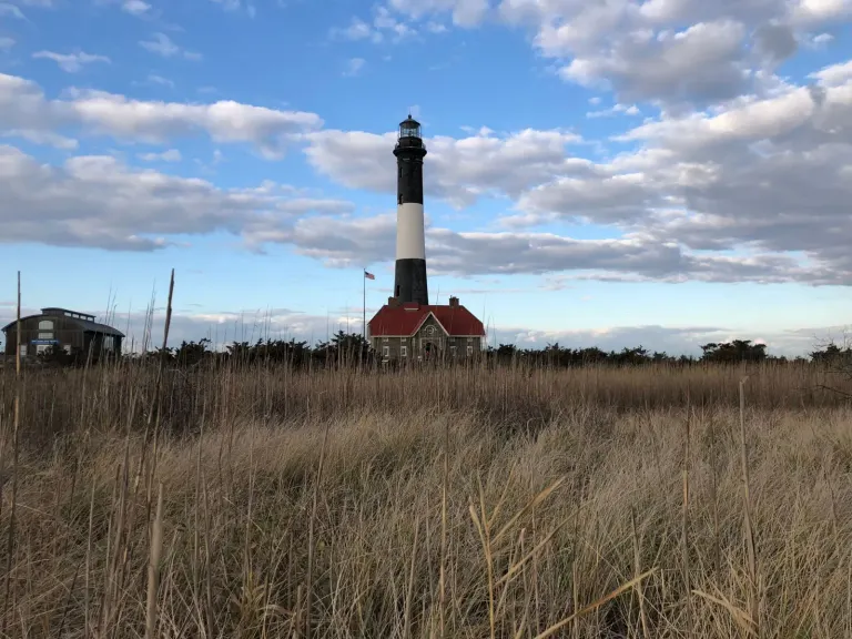 Fire Island Lighthouse rising above the barrier-beach marsh grass on the South Shore of Suffolk County, New York
